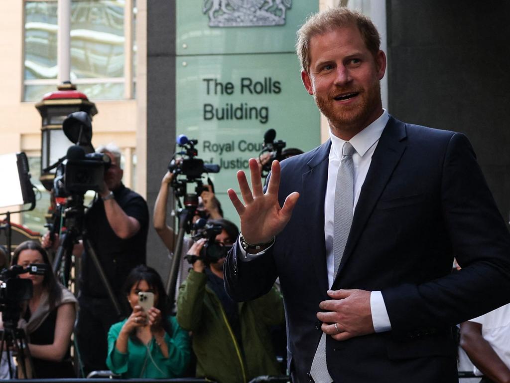 Britain's Prince Harry, Duke of Sussex, waves as he leaves the Royal Courts of Justice, Britain's High Court, in central London on June 7, 2023. Prince Harry on June 6 testified he had suffered lifelong "press invasion" and that some media had blood on their hands, as he became the first British royal in more than 100 years to give evidence in court. Harry is among a number of celebrity claimants seeking damages from Mirror Group Newspapers (MGN) over unlawful information-gathering, including phone hacking, at its titles. (Photo by Adrian DENNIS / AFP)