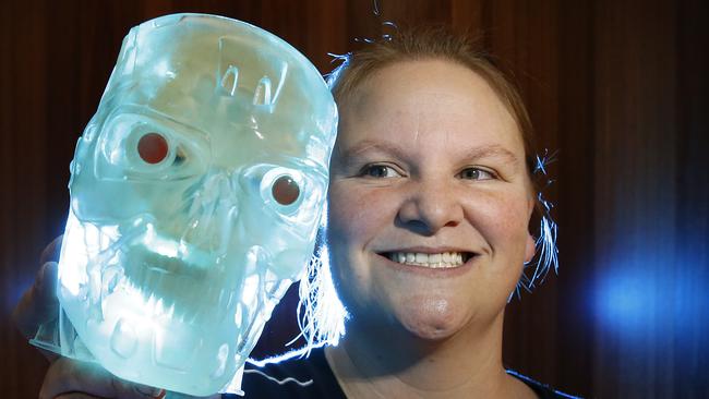 Pride of Australia. Kate Fox is a biomedical engineer, RMIT lecturer and mother of two who helped design the bionic eye using diamonds. She has had an extensive career in STEM, even dabbling in law. Her research has helped people live a full life and has been driven by her son who is vision impaired and has cerebral palsy. Kate holds a 3D printed Terminator skull in the RMIT lab.    Picture: David Caird