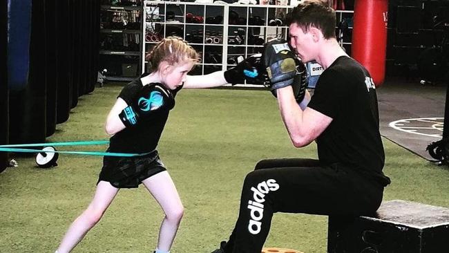 Fitlife head boxing coach Chris Kell with Evie.