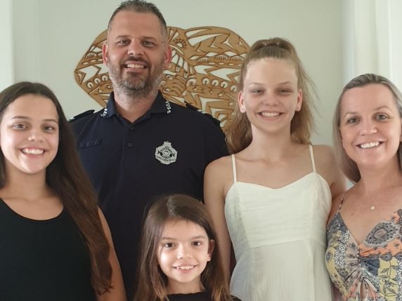 Police officer Scott Roberts pictured with his family. Mr Roberts was diagnosed aged just 38.