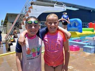 FUN IN THE SUN: Charlotte Cross and Zara Taylor at the Chinchilla Pool Party on November 24. Picture: Amani Vassiliou