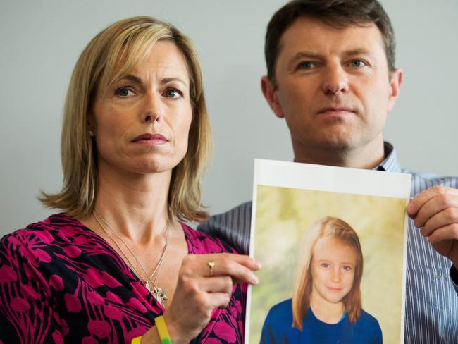 Parents of missing girl Madeleine McCann, Kate (L) and Gerry McCann (R) pose with an artist's impression of how their daughter might look in 2012. Picture: AFP