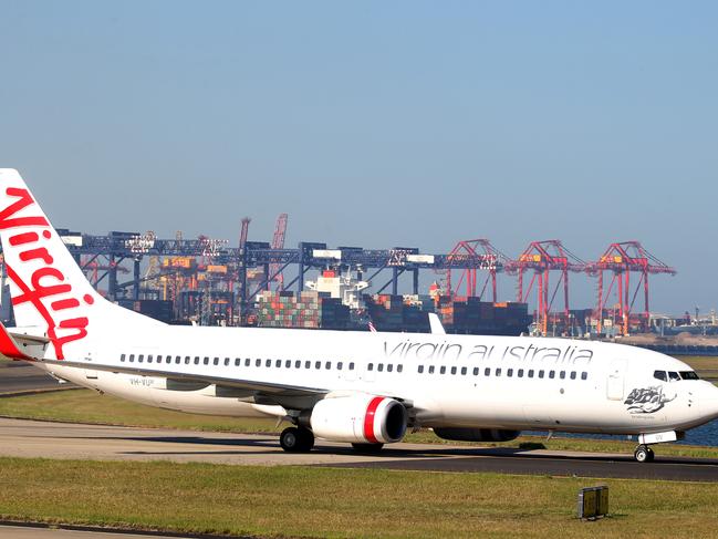 NOT SURE OR NOT IF THIS IS THE VIRGIN PLANE THAT HAD SMOKE ON BOARD. Emergency Services at Gate 16 of Sydney Airport for a Virgin Aircraft emergency. A Virgin Australia (domestic) aircraft on approach to Sydney has issued an emergency call reporting that the cabin is full of smoke. Pic Chris Pavlich