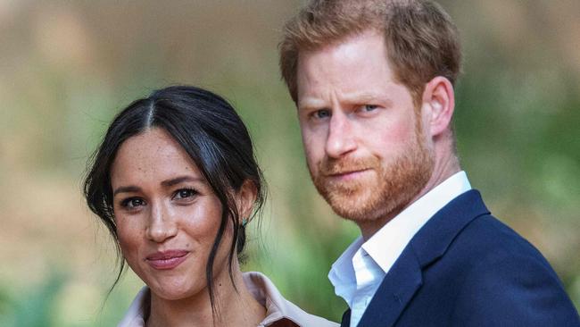 Britain's Prince Harry, Duke of Sussex (R) and Meghan, the Duchess of Sussex (L) have spoken out about Afghanistan.