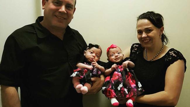 Mackay's Sarah Atkins and Terry Johnson with their four-month-old twin daughters, Jorja and Aleira.