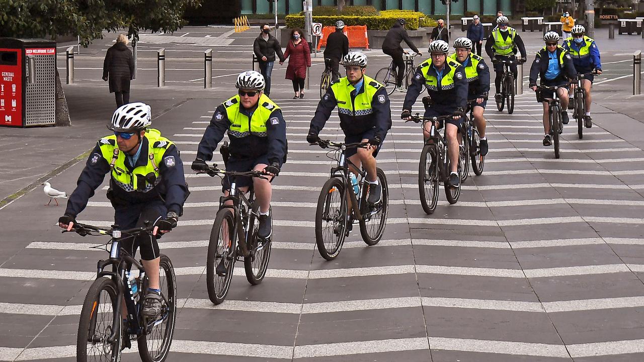 Police officers are out in force in Melbourne enforcing the curfew and other measures. Picture: William West/AFP