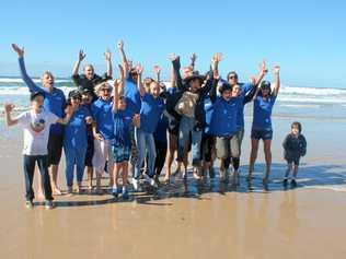 The Australian Seabird Rescue crew celebrate another successful turtle release at Ballina's Lighthouse Beach on July 10. Picture: Graham Broadhead