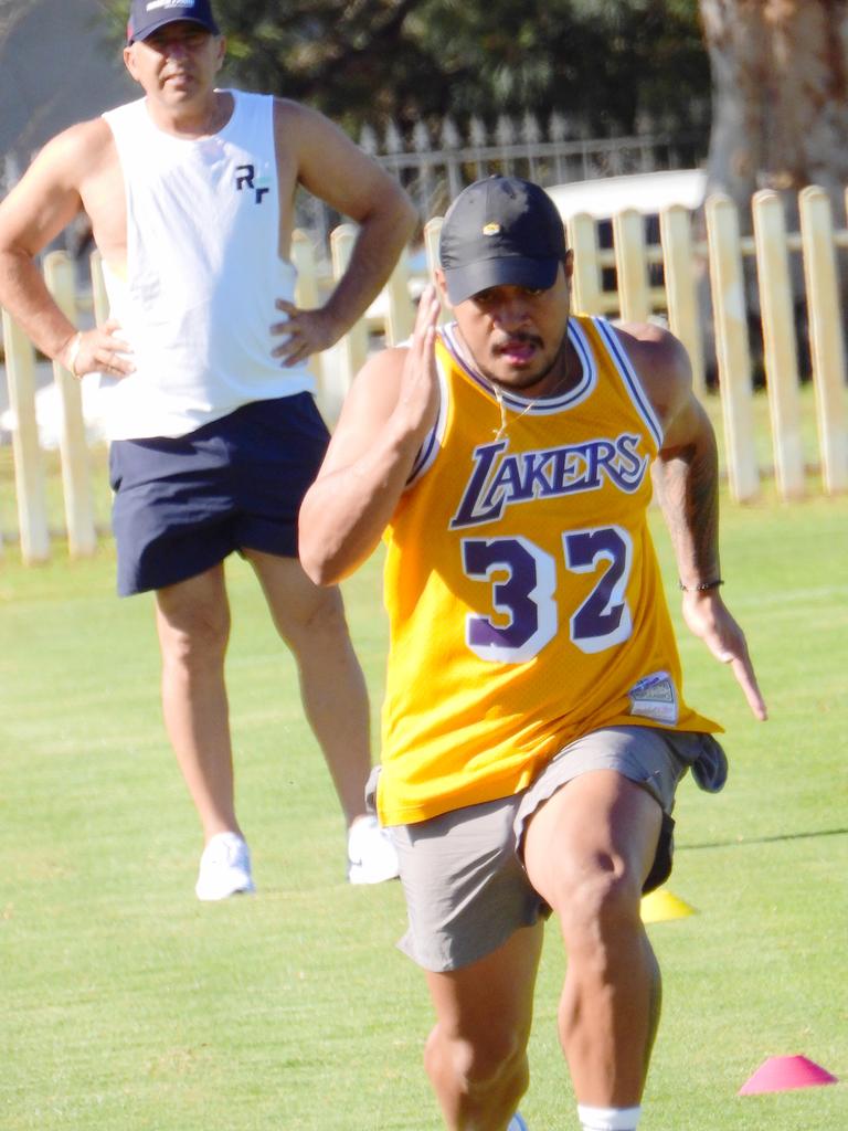 Trainer Roger Fabri working with Anthony Milford in Maroubra. Picture: John Grainger