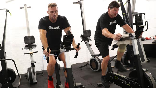 Bryce Cartwright sweats it out with former NRL hardman Mark Carroll as he prepares for a comeback with the Parramatta Eels. Pictures: Brett Costello