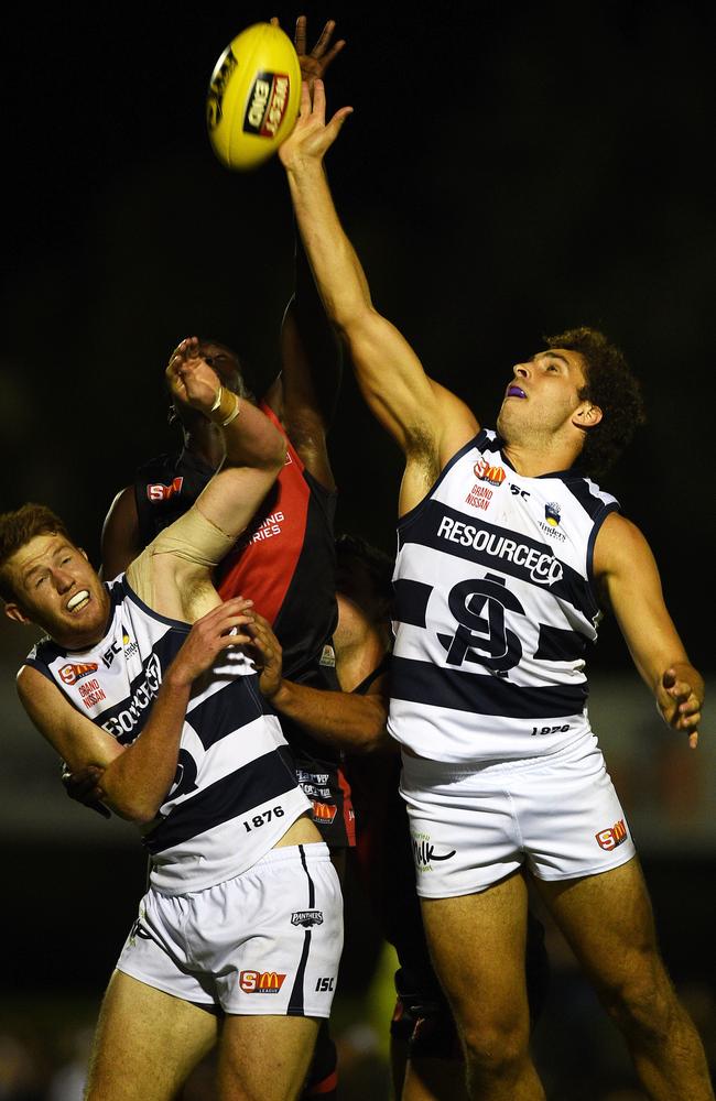 South Adelaide’s Codey Ellison gets the hitout against West Adelaide.