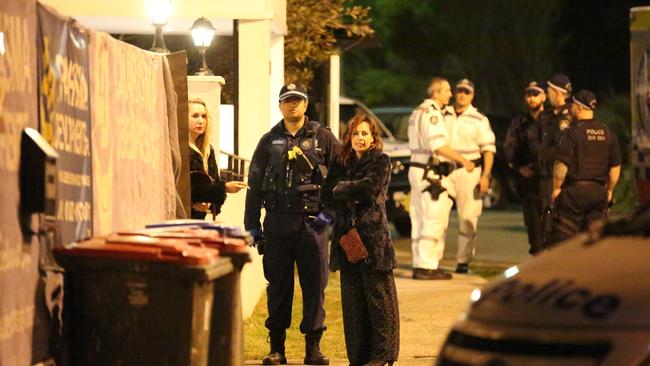 Residents talk to police at the North Bondi apartment block where Jordan Byrne was stabbed.