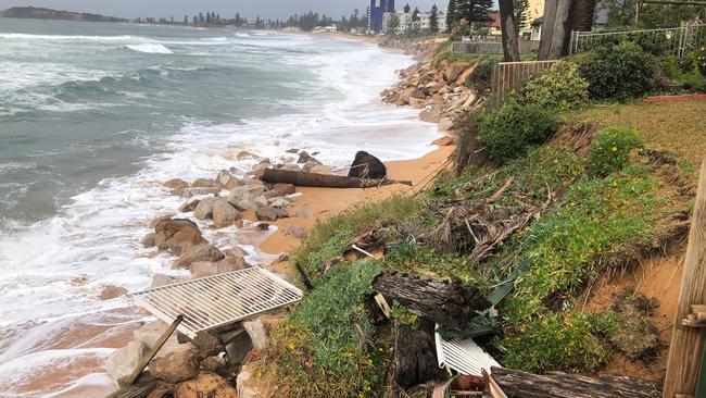 Beach erosion at the rear of a property in Goodwin St, Narrabeen caused by overnight waves reaching as high as 2.4m battered the coastline. Picture: Julie Cross