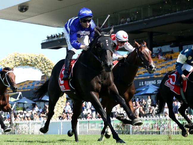 SYDNEY, AUSTRALIA - MARCH 30: Tommy Berry riding Wymark wins Race 4 The Toyota Forklifts Tulloch Stakes during Sydney Racing at Rosehill Gardens on March 30, 2024 in Sydney, Australia. (Photo by Jason McCawley/Getty Images)