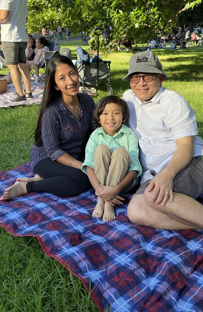 John, Jen and Cayden Kojak at Treasury Gardens in the Melbourne CBD for the 2024 New Year's Eve fireworks. Picture: Gemma Scerri