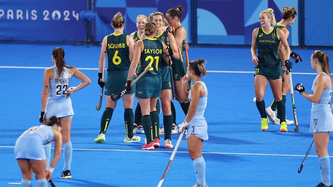 PARIS, FRANCE - AUGUST 01: Mariah Williams of Team Australia (obscured) celebrates scoring her team's third goal during the Women's Pool B match between Argentina and Australia on day six of the Olympic Games Paris 2024 at Stade Yves Du Manoir on August 01, 2024 in Paris, France. (Photo by Alex Pantling/Getty Images)