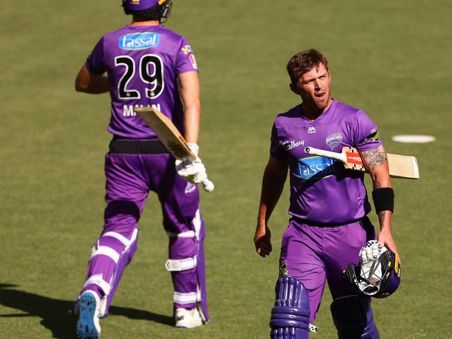 PERTH, AUSTRALIA - JANUARY 12: Ben McDermott of the Hurricanes walks from the field after being dismissed by JhyeÃÂ RichardsonÃÂ of the Scorchers during the Big Bash League match between the Perth Scorchers and the Hobart Hurricanes at Optus Stadium, on January 12, 2021, in Perth, Australia. (Photo by Paul Kane/Getty Images)