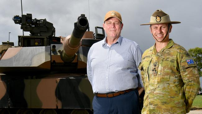 Northern Australia AIG head Dean Deighton and Commanding Officer 3rd Brigade Brigadier Ben McLennan with a new M1A2 Abrams SEPv3 main battle tank at Lavarack Barracks. Picture: Evan Morgan