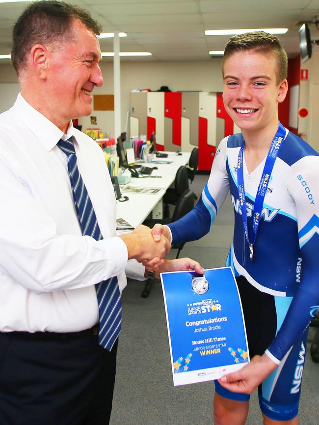 Rouse Hill Times editor John Bilic hands over the JSS Award to Joshua Brodie. Picture: Phil Rogers