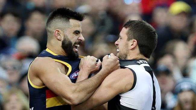 Tempers flare between Wayne Milera and Port captain Travis Boak. Picture: SARAH REED