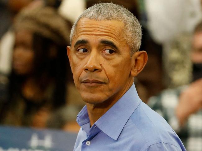 Former US President Barack Obama campaigns for Michigan Governor Gretchen Whitmer (L) during a "Get Out the Vote Rally" ahead of the midterm elections,at Renaissance High School in Detroit, Michigan, on October 29, 2022. (Photo by JEFF KOWALSKY / AFP)