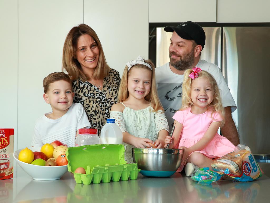 The Plomarit family, Nicolas, 5, Irene, Teri, 7, Noel, and Anais, 3, at home, in Panania, know how to keep costs down. Picture: Justin Lloyd