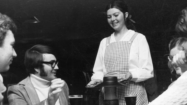 Waitress serving diners at a dine-in Pizza Hut in July 1972. Picture: Staff photographer