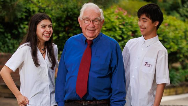 Laura Sofia Umbarila, 15, John Quinnell, and Jerry Tang, 15, at Kogarah High School, today. John Quinnell has worked for the Department of Education for 60 years. Picture: Justin Lloyd.