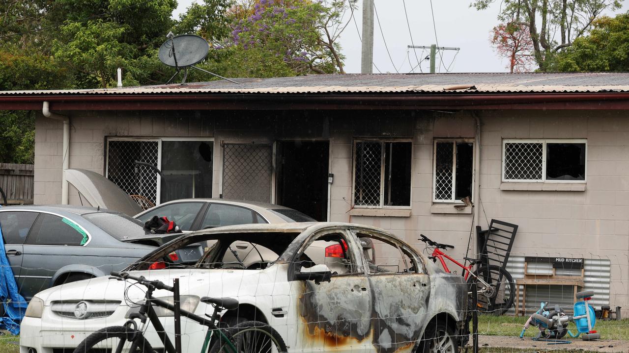 Investigators at the crime scene of a suspicious fire at Landsborough where a house and car were destroyed on Sunday night. Picture Lachie Millard