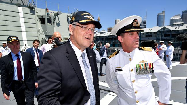 Prime Minister Scott Morrison and Minister for Defence Christopher Pyne greet Navy personnel onboard HMAS Brisbane after a commissioning ceremony last weekend.