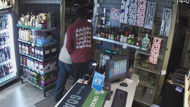 The men after captured on CCTV running out of the shop. Picture: Supplied