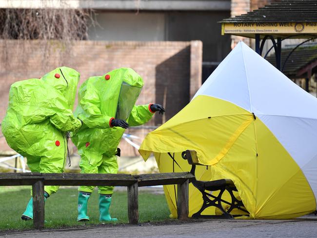 Authorities investigate the bench where Sergei and Yulia Skripal were found. Picture: AFP/Ben Stansall