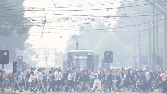 Smoke haze from the bushfires blankets Melbourne yesterday, stopping tennis matches and prompting health warnings. Picture: AAP