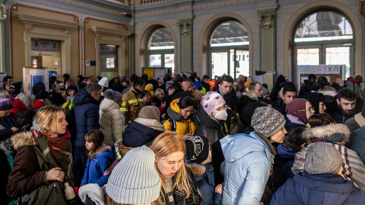 Refugees from Ukraine are seen resting in temporary reception point organised in the main railway station in Przemysl, in eastern Poland. Picture AFP