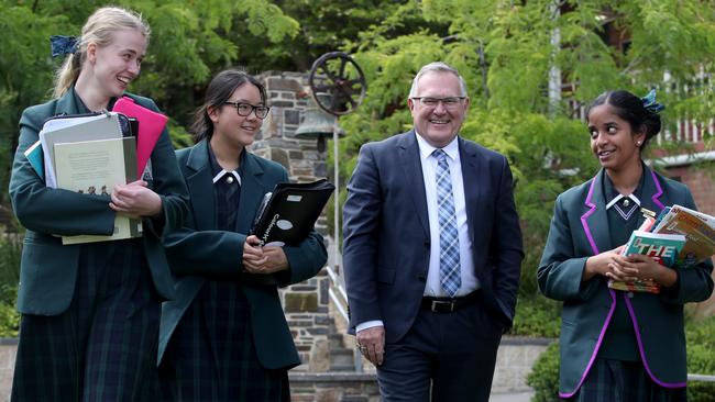 Principal Kevin Tutt with Maddie Habgood, Caitlin Duong and Anjana Prabu at Seymour College in Adelaide where fees have risen just 0.1 per cent. Picture: Kelly Barnes