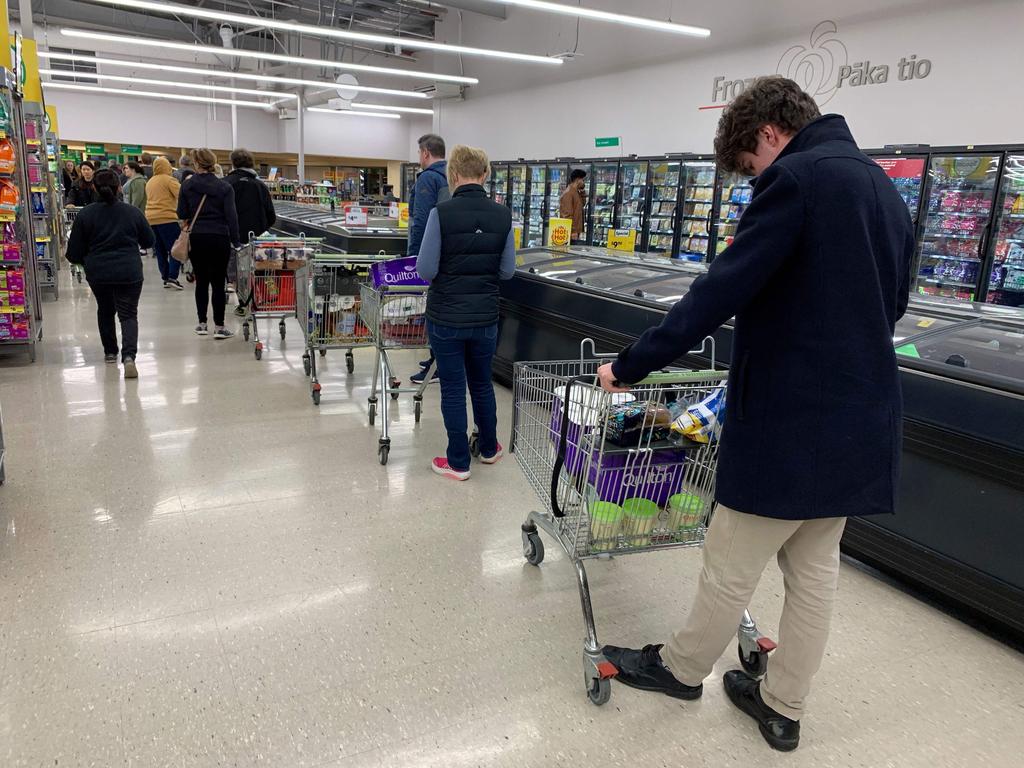 Long lines were seen inside the stores, most customers were seen toilet paper inside their trolleys. Picture: Marty Melville/AFP