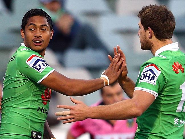 CANBERRA, AUSTRALIA - AUGUST 30: Raiders players Dane Tilse, Anthony Milford and Jarrad Kennedy celebrate the try of Bill Tupou during the round 25 NRL match between the Canberra Raiders and the Wests Tigers at GIO Stadium on August 30, 2014 in Canberra, Australia. (Photo by Renee McKay/Getty Images)