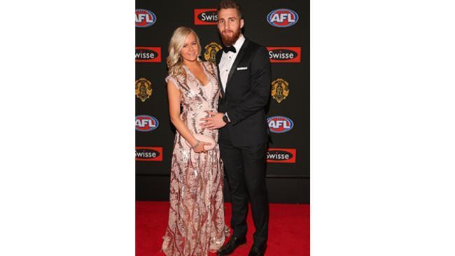 There's something about a man, a suit and his beard. Zach Tuohy of the Blues with Rebecca Price. (Photo: Getty)