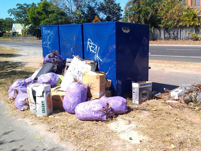 Jim Tregilgas (supplied this photo of items left at bins), a gardener, who works around the Lifeline donation bins on Smithfield�s Cheviot St says scavengers and a lack of signage banning them are to blame for the site�s deterioration into a junkyard.