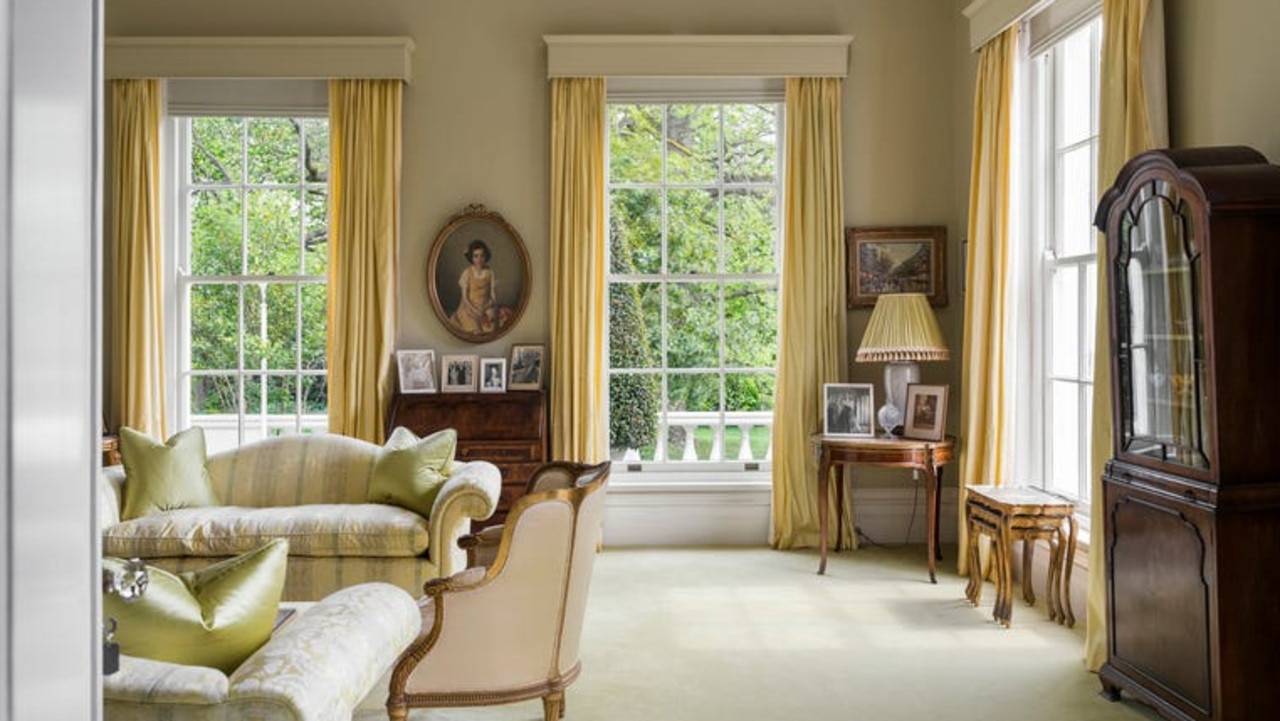 Yellow curtains and cushions add a pop of colour.