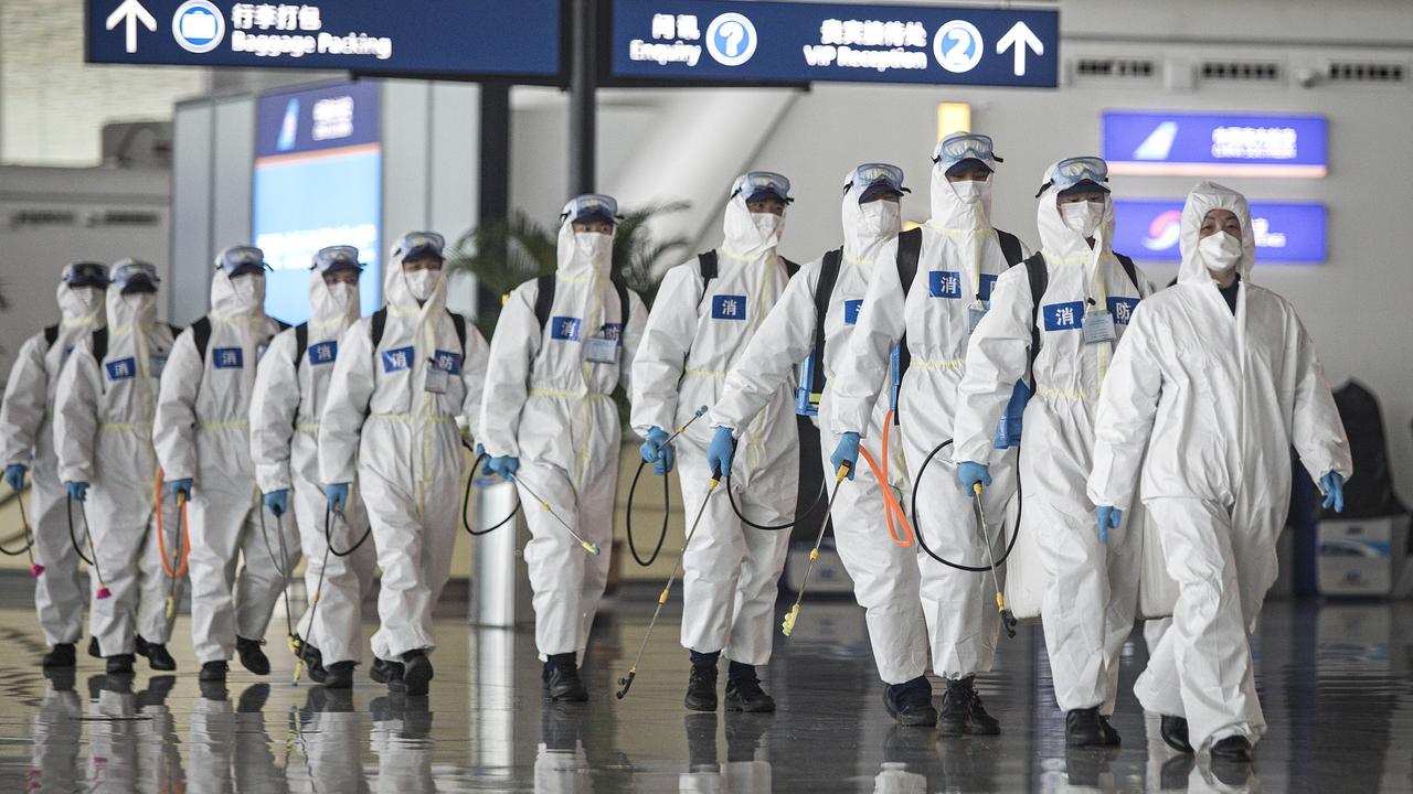 Firefighters prepare to conduct disinfection at the Wuhan International Airport on April 3. Picture: Getty