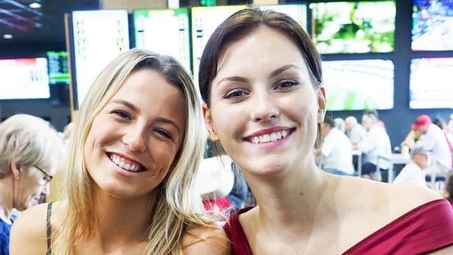 Abbie Hollanby, 22, and Darcy Watt, 23, enjoy the atmosphere at the Gold Coast Turf Club. Photo: Tim Marsden