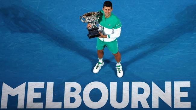 Novak Djokovic holds the Norman Brookes Challenge Cup trophy after winning the Australian Open in Melbourne last year. Picture: AFP