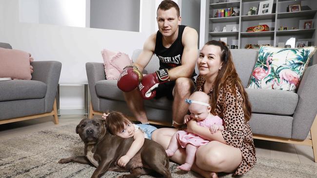 Jeff Horn at home with wife Joanna, daughters Isabelle and Charlotte and the family dog Lexi. Picture: Claudia Baxter