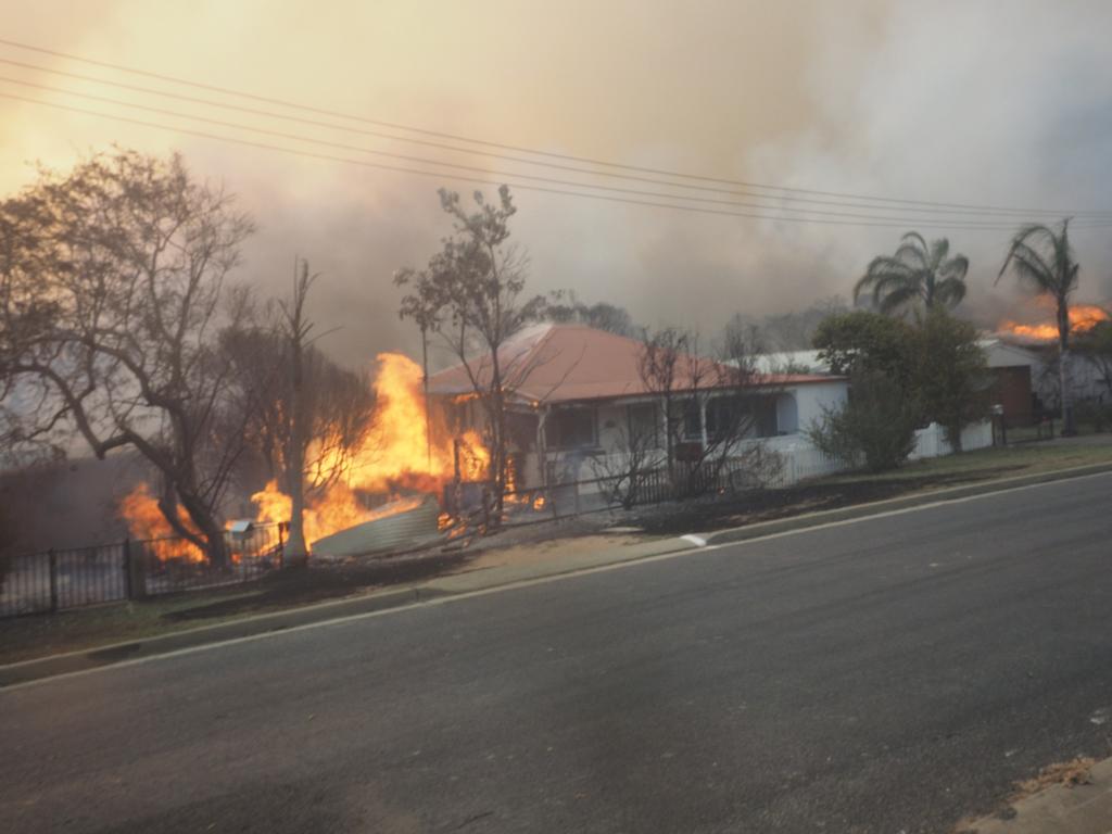 A bush fire rages in the town of Tathra on Sunday afternoon, March 18, 2018. Picture: John Ford