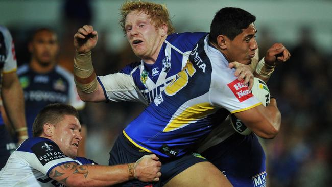 The North Queensland Cowboys Vs Canterbury - Bankstown Bulldogs at 1300 Smiles Stadium Cowboys Jason Taumalolo is tackled by the bulldogs James Graham and Greg Eastwood