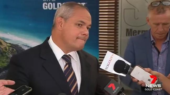 Warwick Sinclair seen behind Mayor Tom Tate.