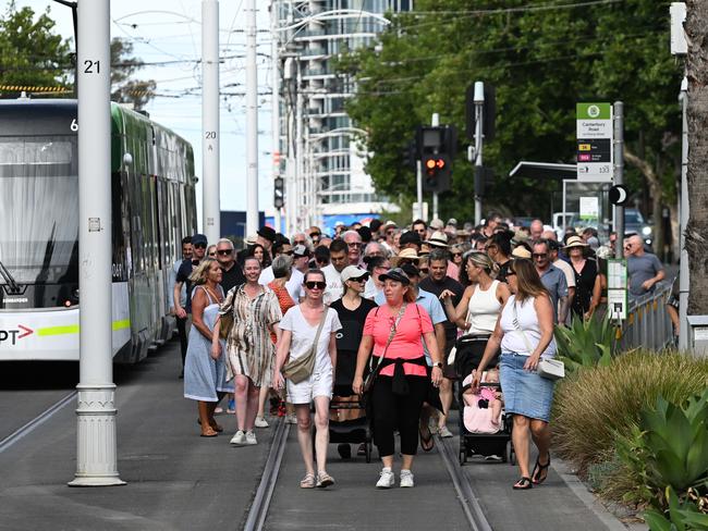 The attendees walked from the St Kilda sports club on Fitzroy St to the Acland Street Village via the Esplanade. Picture: Josie Hayden