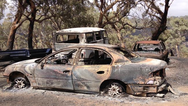 The destroyed cars on former politician Susan Jeanes’ property. Picture: Susan Jeanes