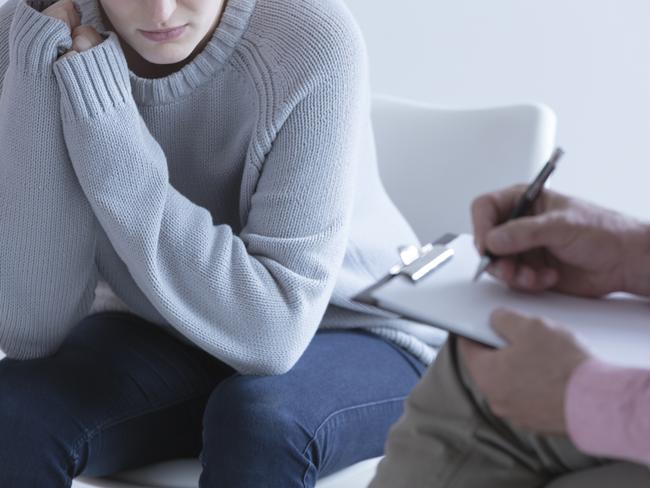 Young girl during session with her psychotherapist