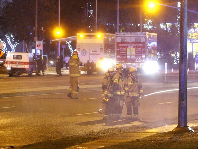 Emergency services seal off the intersection. Picture: Steve Pohlner